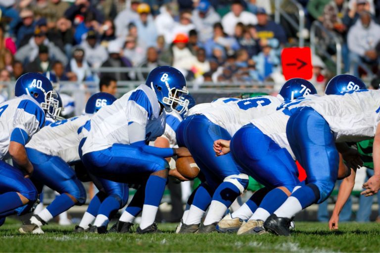 High school students playing football, putting them at risk for a cardiac emergency